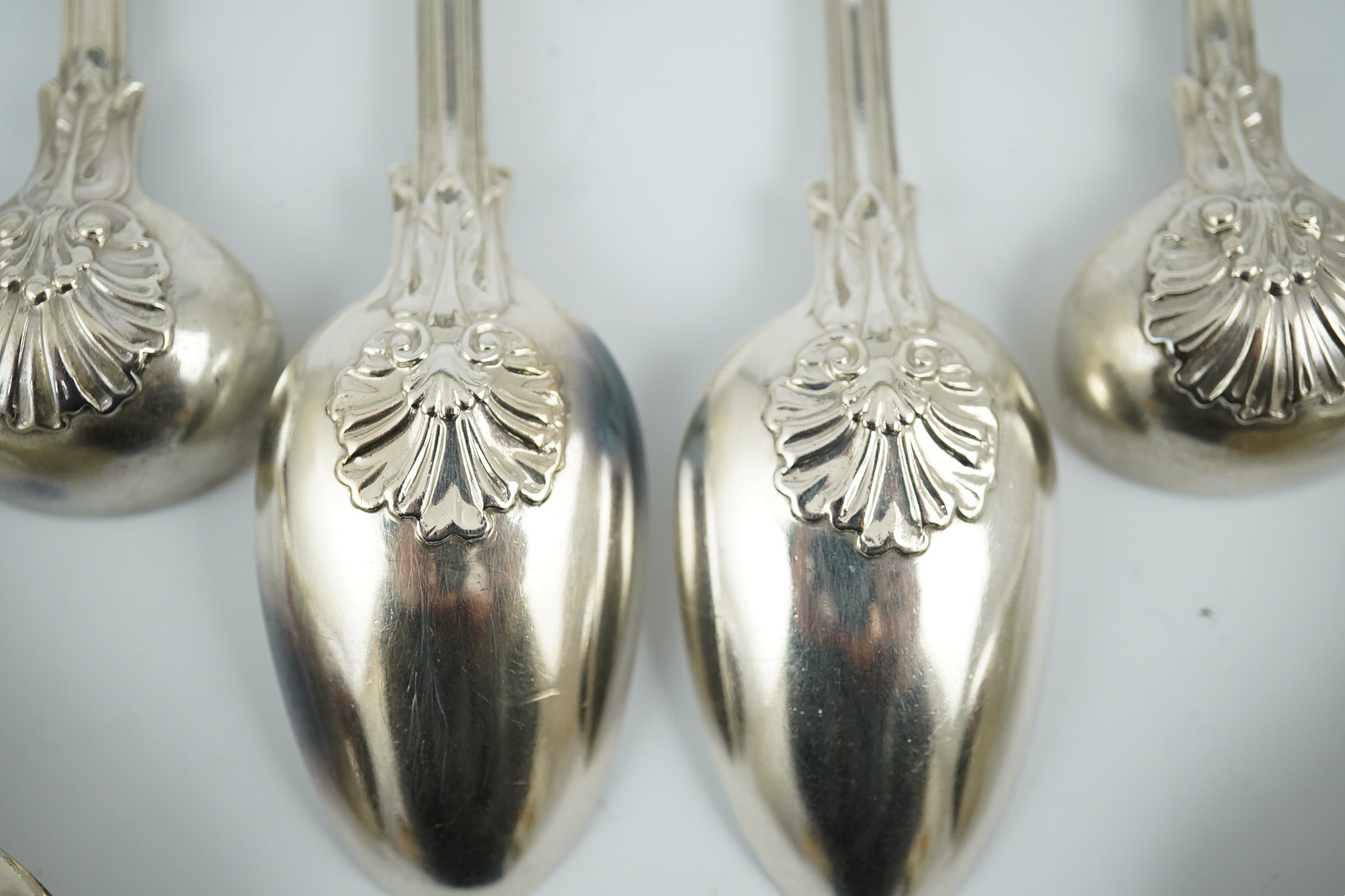 A matched part canteen of George IV and later silver shell scroll pattern flatware